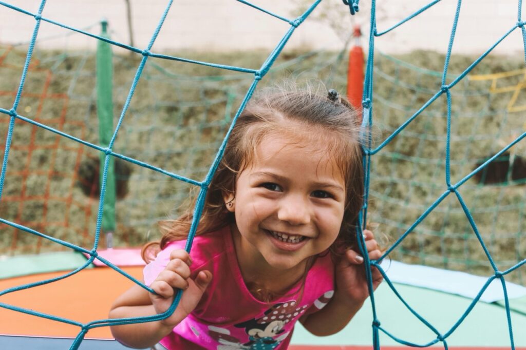 a happy child smiling at the camera